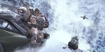 Two soldier-bearing skidoos, running from a helicopter gunship