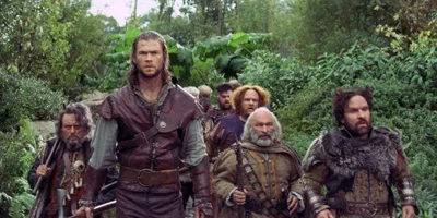 Still of Chris Hemsworth with the Seven Dwarfs